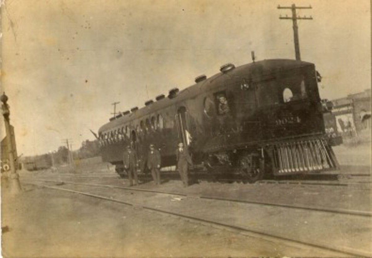Railroad men in their uniform standing by an unusual passenger railroad car, Heavener Railroad men in their uniform standing by an unusual passenger railroad car, Heavener