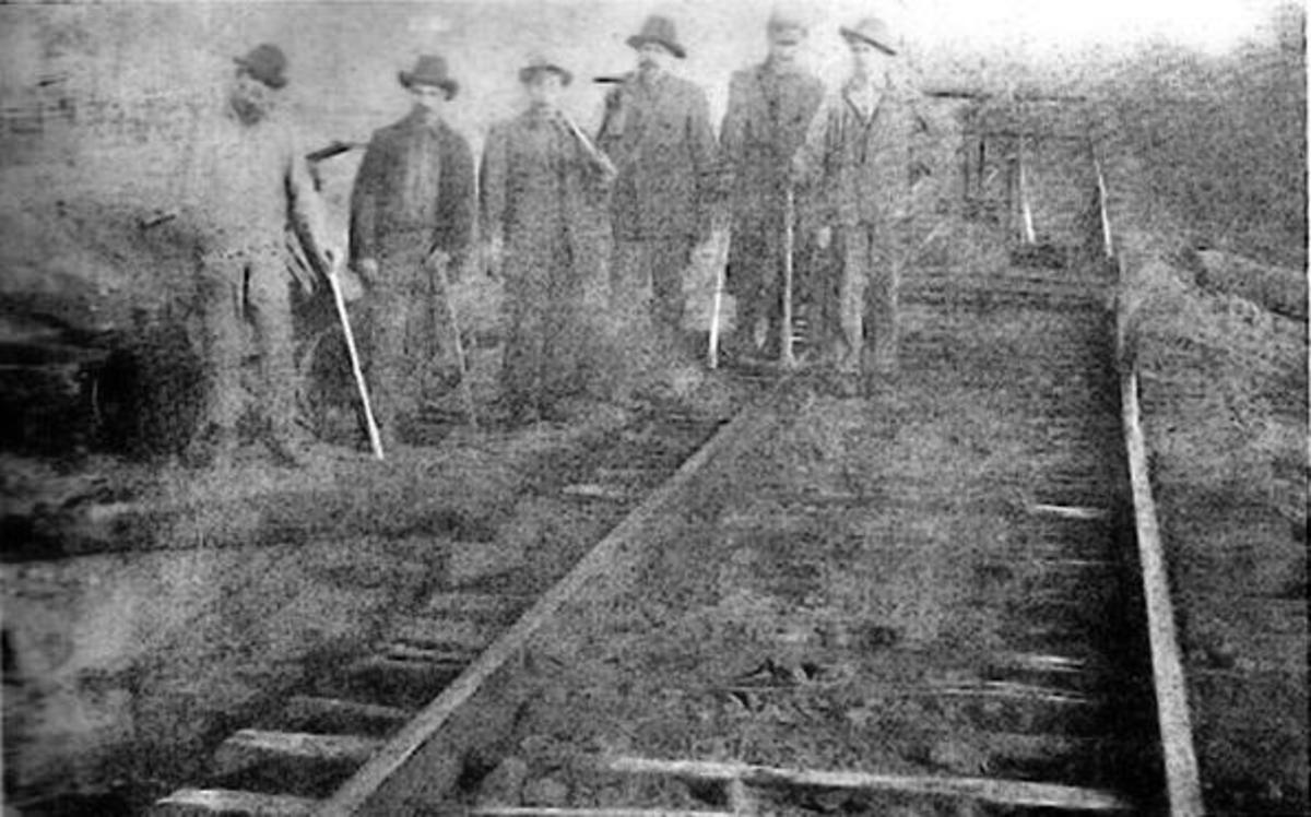 Men working on laying tracks for the KCS railroad.. Men working on laying tracks for the KCS railroad..